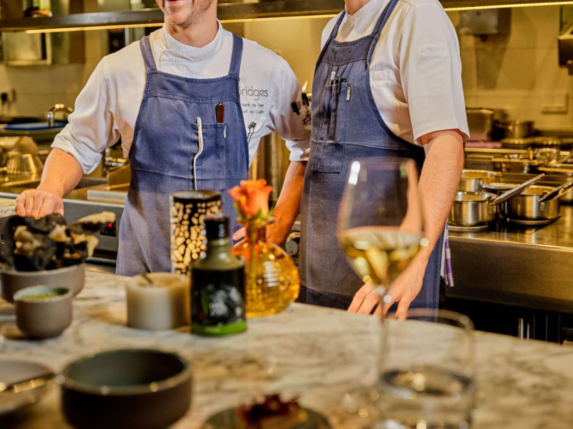 Sofitel Legend The Grand Amsterdam Hotel Екстериор снимка Two chefs in a restaurant kitchen
